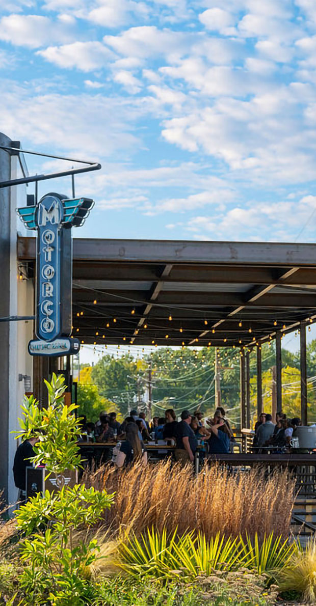 Motorco restaurant with patio seating and string lights.